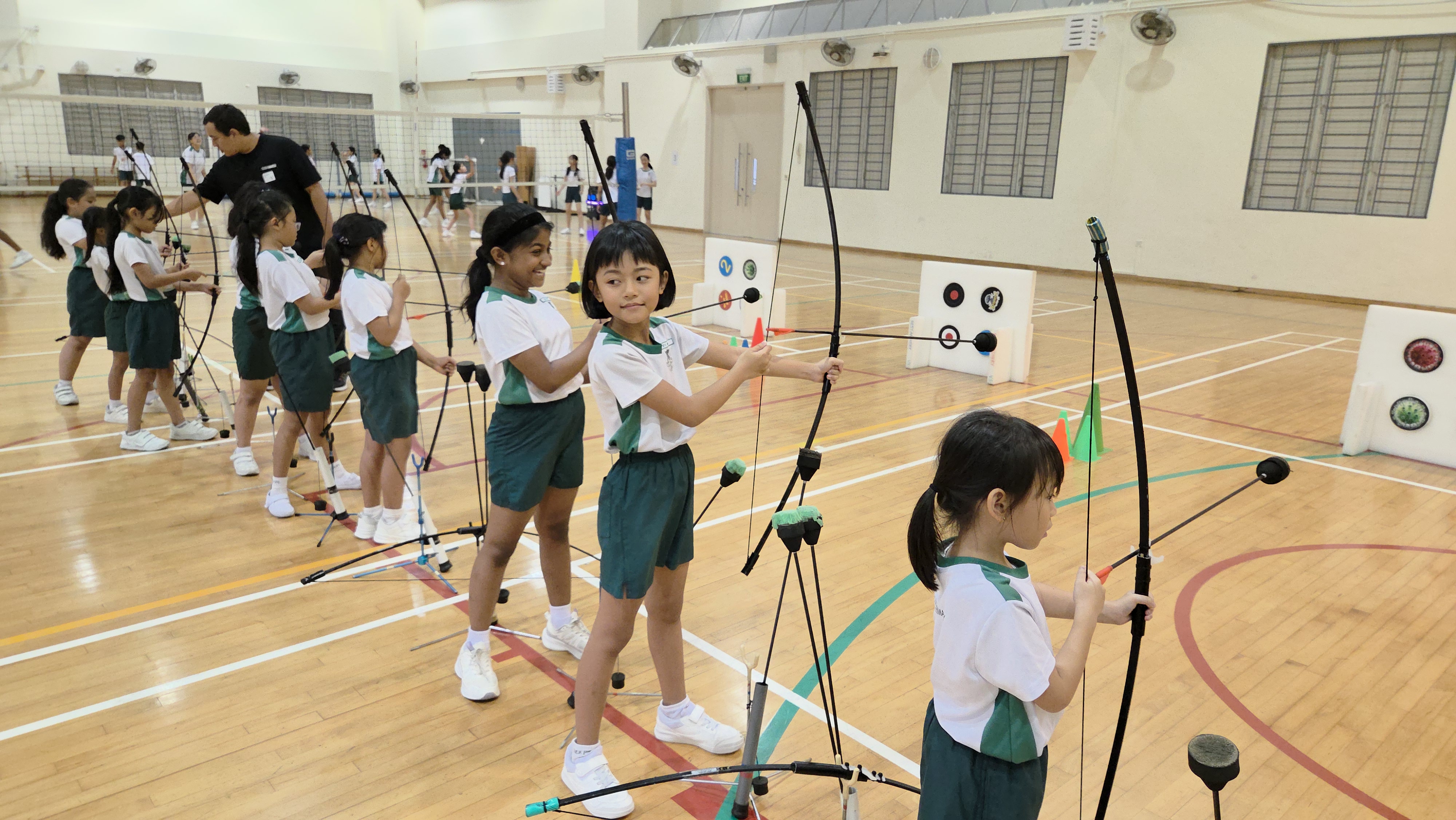 Students taking part in archery